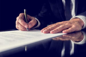 Man signing a Title Deed Search in Easton